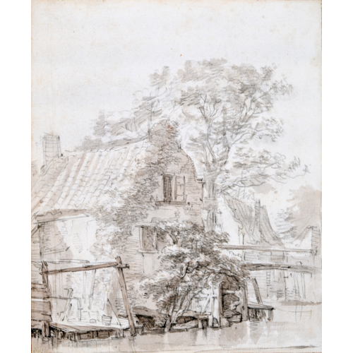 Houses and a tree by the water near a bridge
